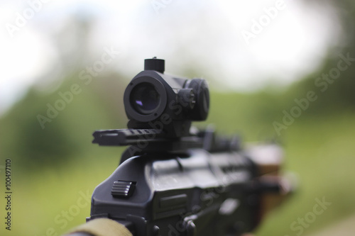 Man aiming at a target and shooting an automatic 