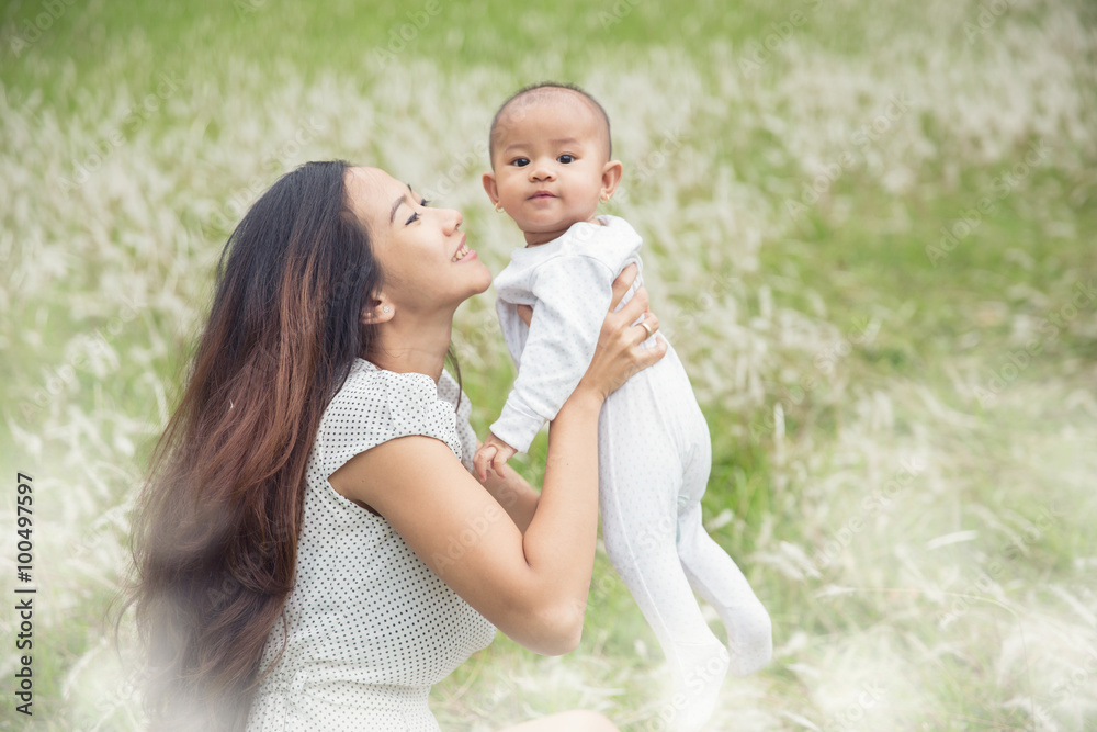 mother and her baby having fun together outdoor mother and her baby having fun together outdoor