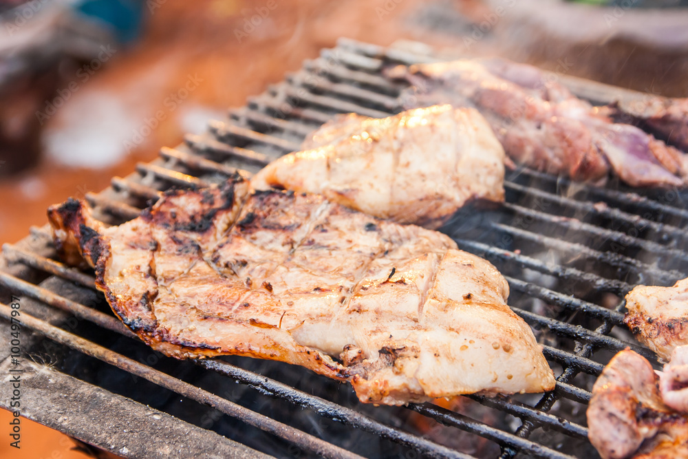 grilled pork on the flaming