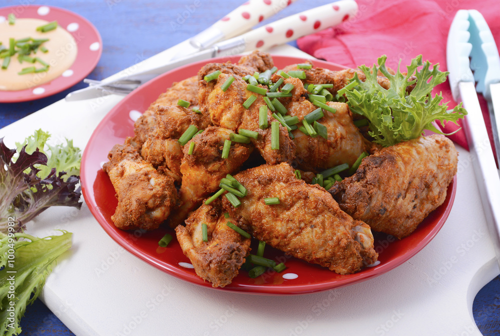 BBQ setting with spicy chicken wings. BBQ setting with spicy chicken wings.