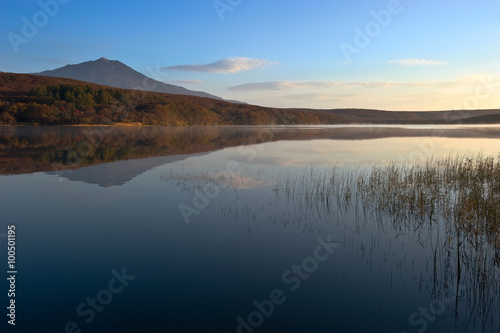 Quiet lake at sunrise.