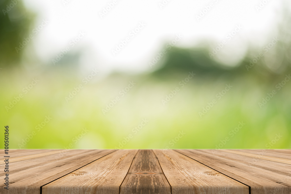 Wooden board empty table in front of blurred background. Perspective brown wood over blur trees in forest - can be used for display or montage or mock up your products. your products. spring season. Wooden board empty table in front of blurred background. Perspective brown wood over blur trees in forest - can be used for display or montage or mock up your products. your products. spring season.