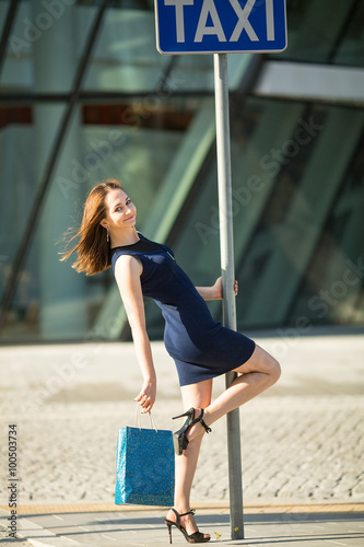 Girl on the street after shopping.