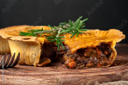 Photos Piece of Australian meat pie with rosemary