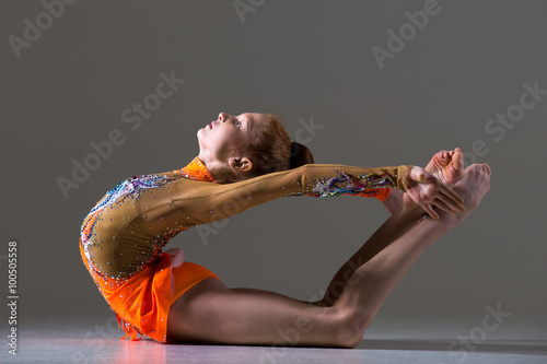 Dancer girl doing backbend athletic exercise