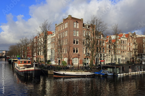 View of Amsterdam canal, typical dutch houses and boats, Holland, Netherlands. © AnastasiiaUsoltceva
