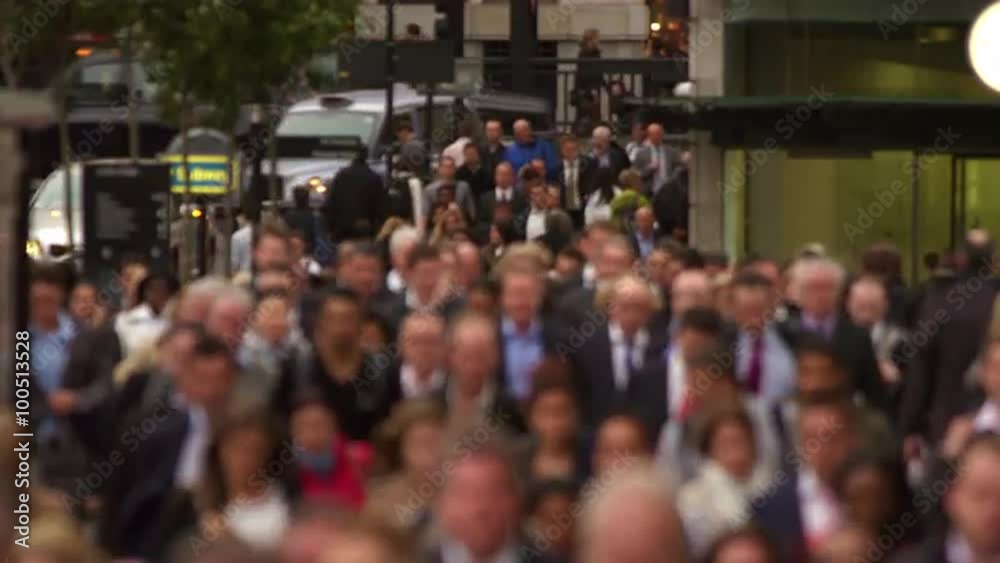 Business people on a crowded busy street in a big city, London
