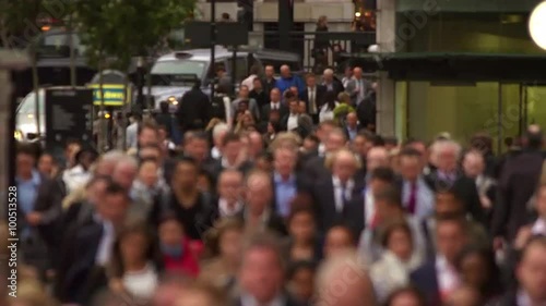Business people on a crowded busy street in a big city, London