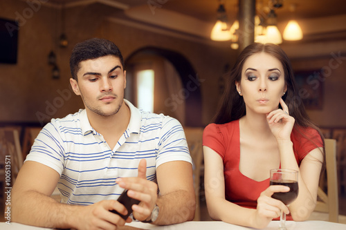 Obraz na plátne Curious Girl Spying Boyfriend on Smartphone