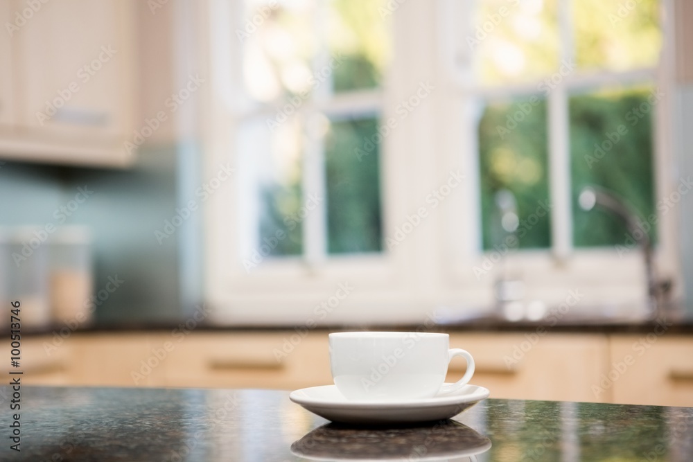 White cup on kitchen counter White cup on kitchen counter