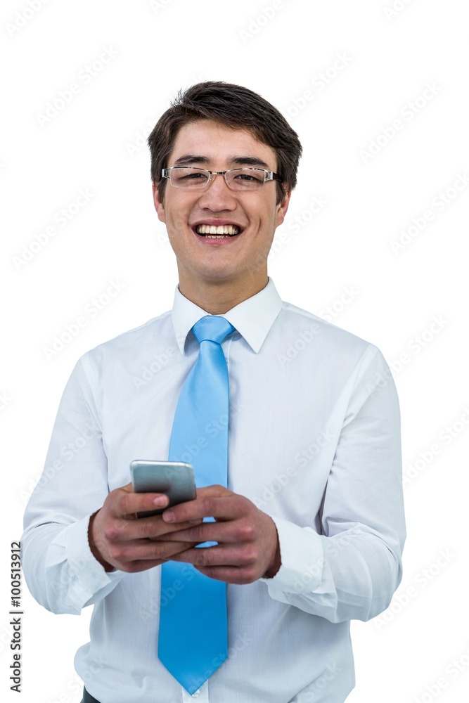 Smiling asian businessman using his telephone Smiling asian businessman using his telephone