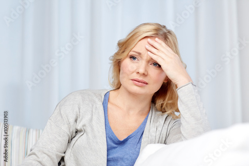 woman suffering from headache at home