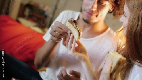 hipster eating and using a tablet computer