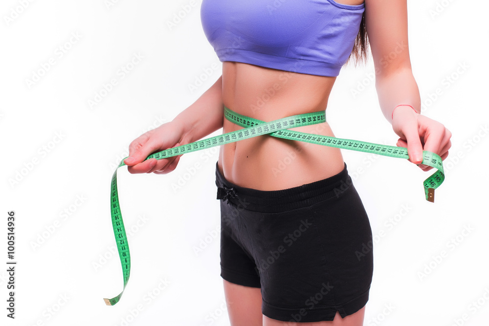 Slim Young Woman Measuring Her Waist With A Tape Measure Stock Photo -  Download Image Now - iStock