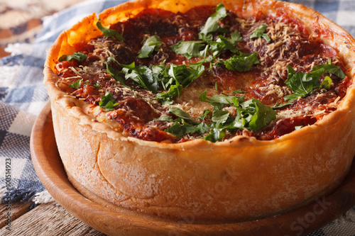 Whole Chicago style deep dish pizza closeup on the table. horizontal
 photo