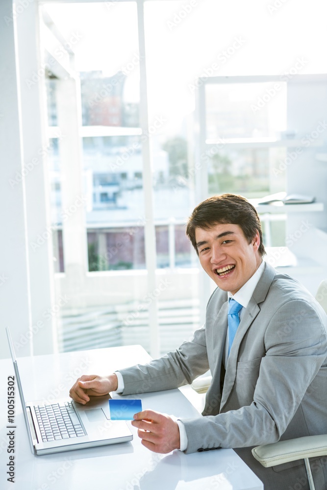 Asian businessman holding a business card 