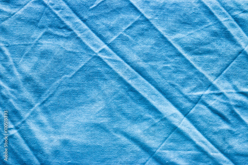 crumpled blue linen fabric background