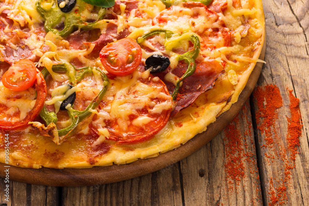 pizza served on wooden table pizza served on wooden table
