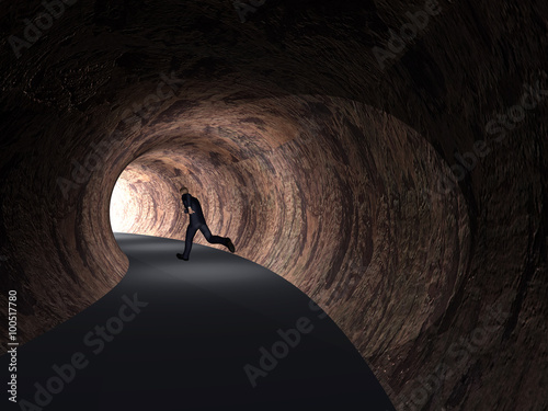 Fototapeta Naklejka Na Ścianę i Meble -  Conceptual 3D business man, road tunnel with light at the end