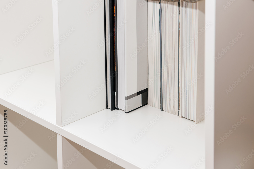 Home library with modern books - side view Home library with modern books - side view