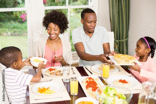 Happy family eating together