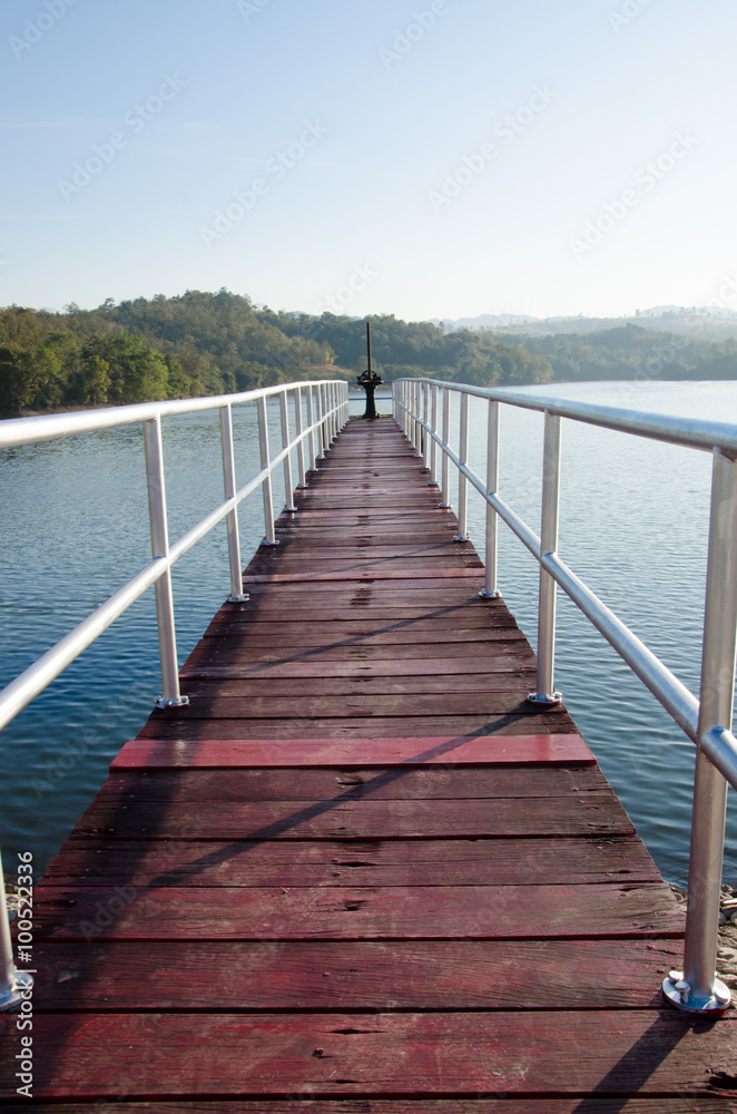 Bridge embankment in the morning with mountains in the backgroun