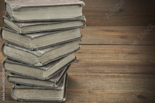 Old Shabby Books In Stack On The Wood Horizontal Background