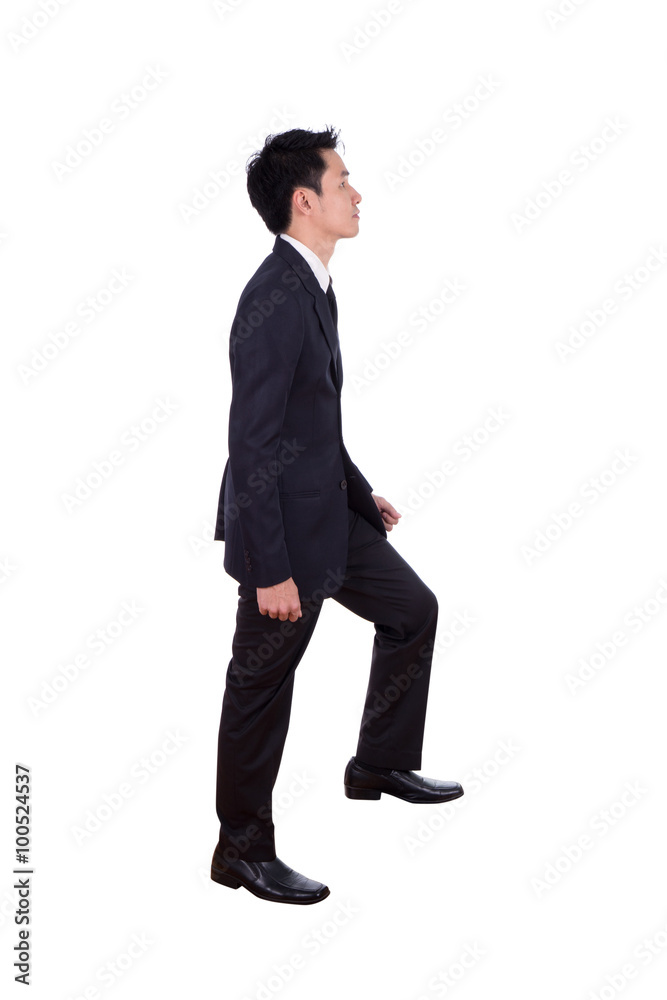 Side view of man in suit stepping up isolated on white Side view of man in suit stepping up isolated on white