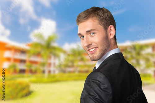 Young Businessman looking over his shoulder