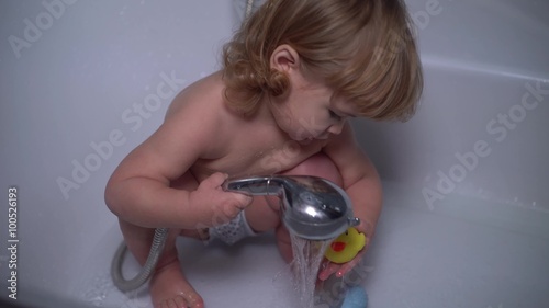 4K little cute baby duck in the shower washes