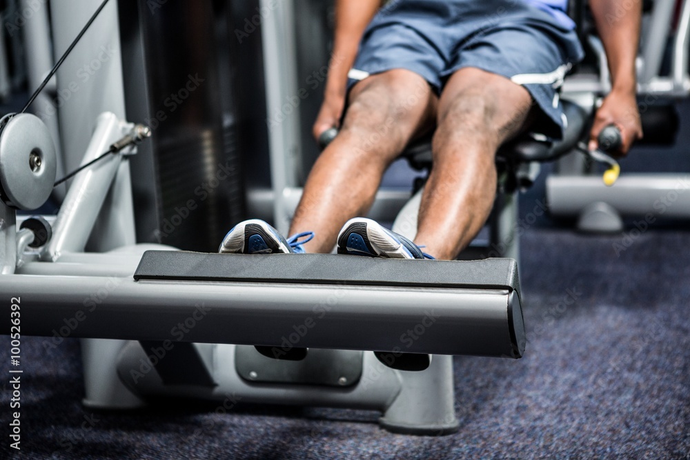 Cropped image of man using exercise machine Cropped image of man using exercise machine