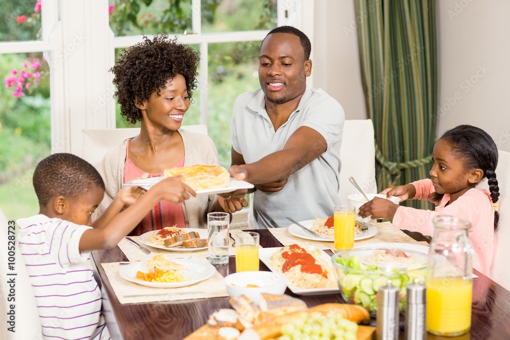 Happy family eating together