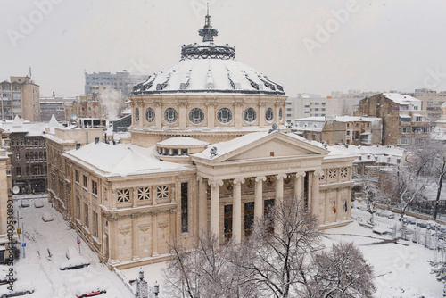 Bucharest in a winter day: Romanian Athenaeum, one of the most important landmarks in Bucharest. photo