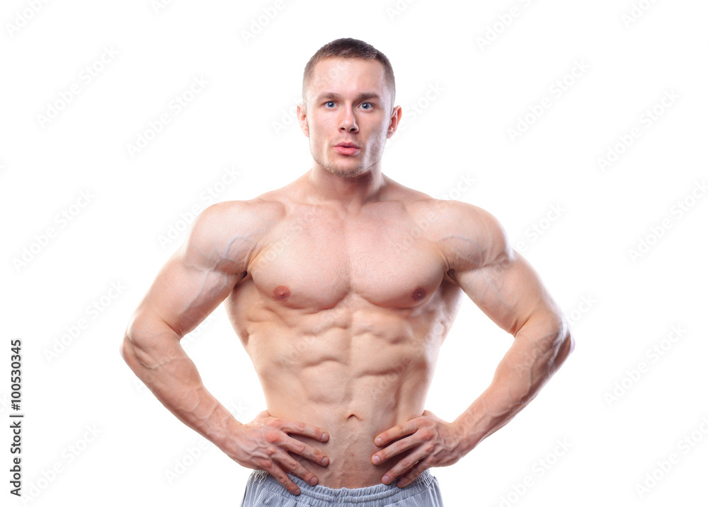 Muscular man posing over white isolated background