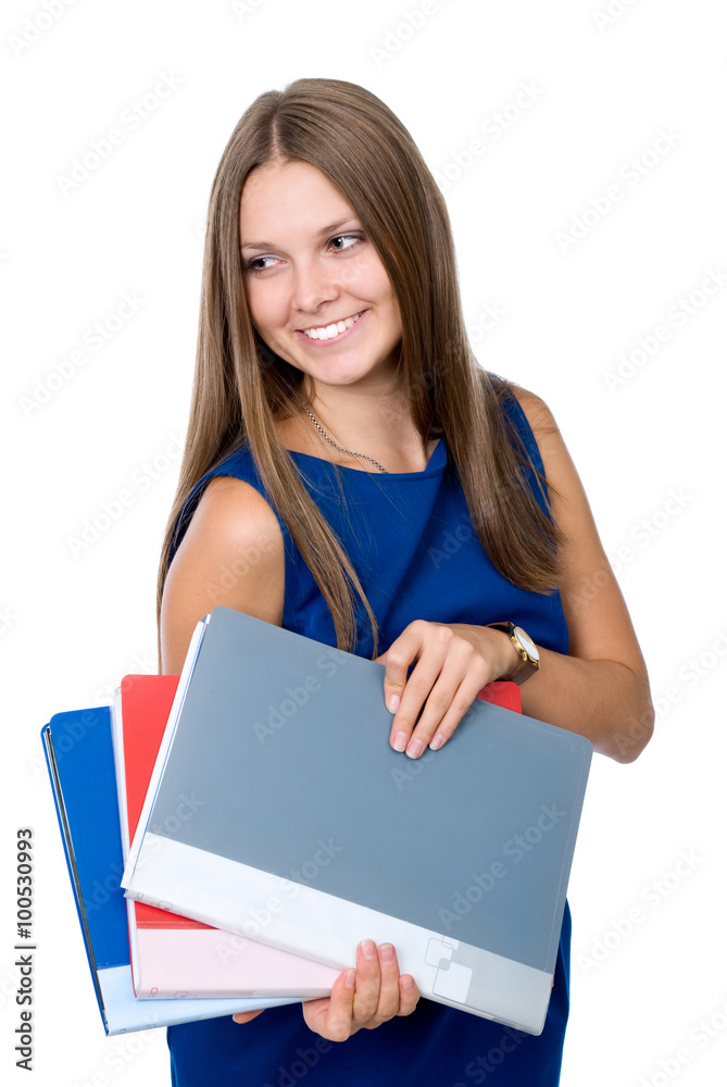 Cheerful girl in a blue dress with folders for documents looks a Cheerful girl in a blue dress with folders for documents looks a