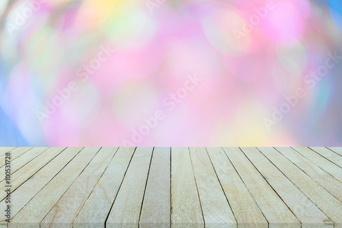 Empty top view of wooden table or counter on colorful bokeh back