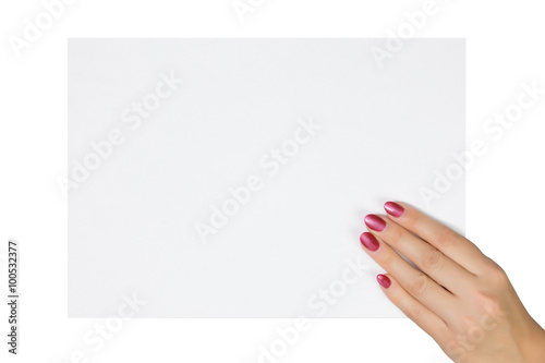 woman's hand holding a blank sheet of paper