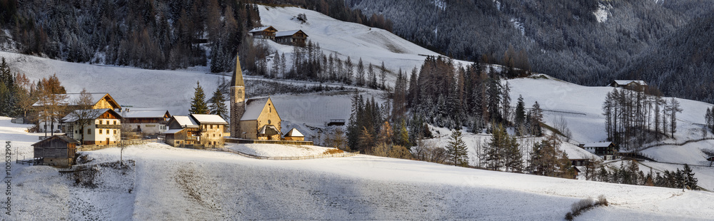 sun light on the hill and church in Dolomite in Italy