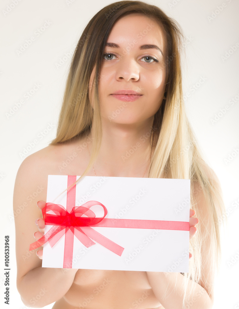 beautiful girl in lacy shorts with an envelope tied with a ribbon beautiful girl in lacy shorts with an envelope tied with a ribbon