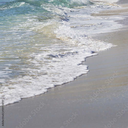 Wave of the sea on the sand beach