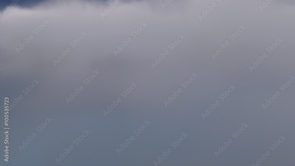 A flight through fluffy clouds, with darkness above and calm blue sky underneath. A flight through fluffy clouds, with darkness above and calm blue sky underneath.