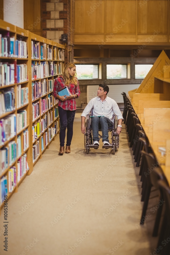 Student in wheelchair talking with classmate Student in wheelchair talking with classmate
