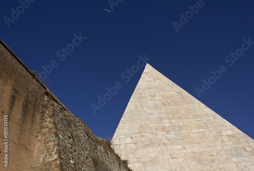 Pyramid of Celsius and roman ancient walls in Rome, Italy
