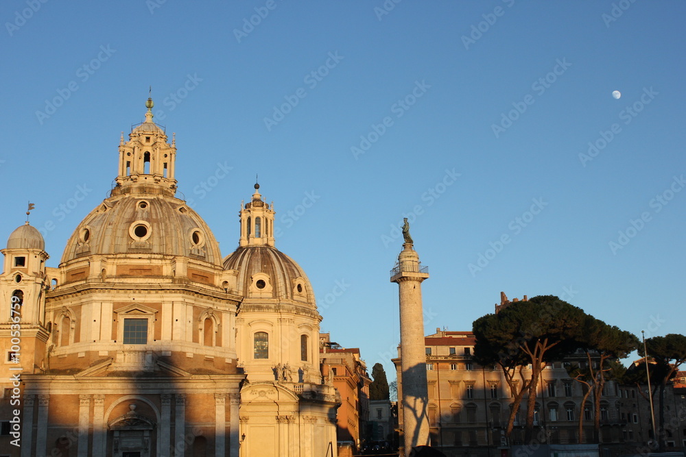 view at sunset time of the Trajan column and the Santa Maria di Loreto Church in Rome, Italy