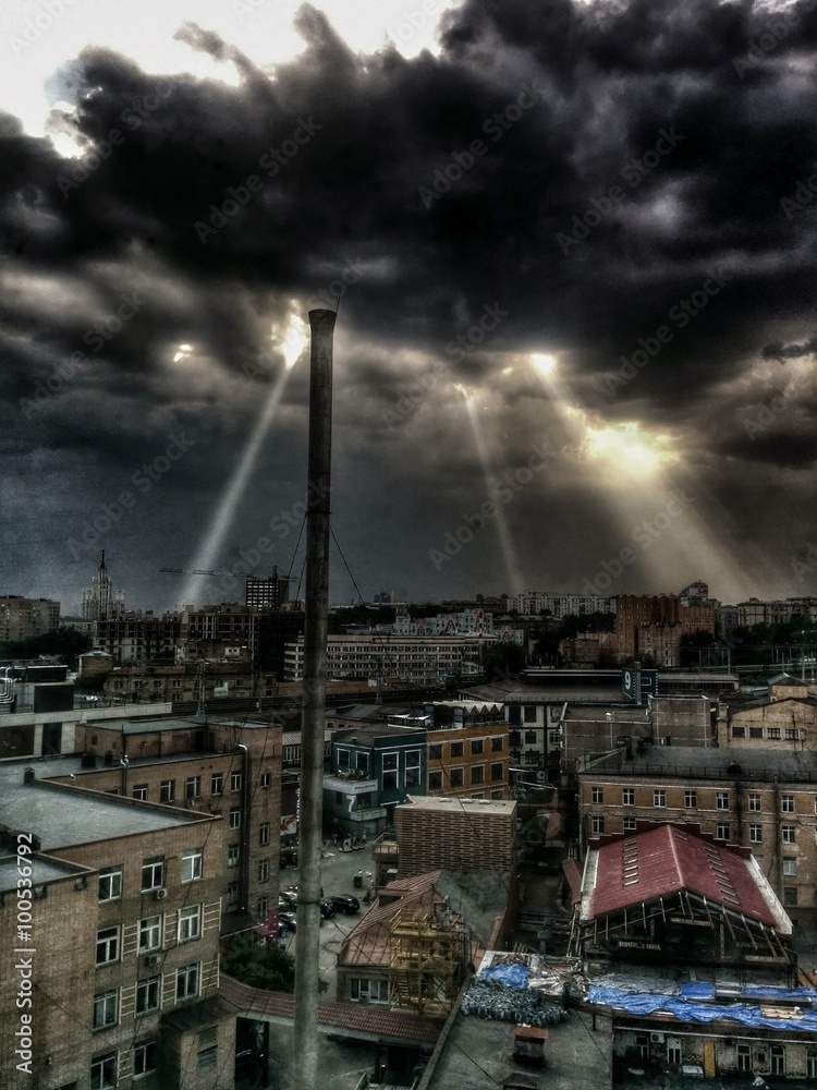 Light through the dark scary clouds before storm in Moscow Light through the dark scary clouds before storm in Moscow
