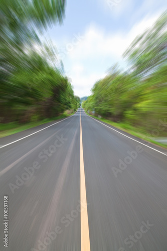 Road in Countryside with zoom blur technique used for high speed