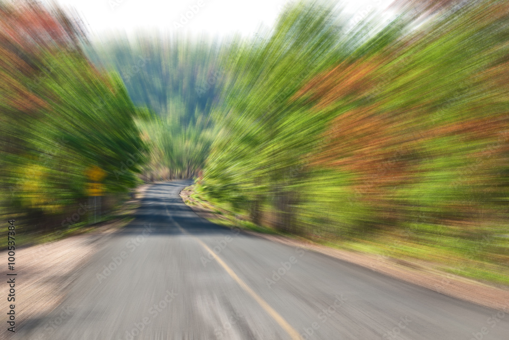 Road in Countryside with zoom blur technique used for high speed