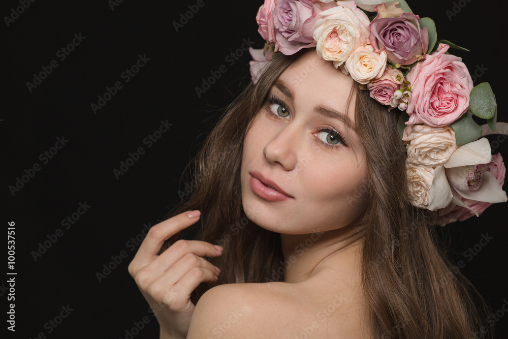 Lovely woman with wreath from flowers on head