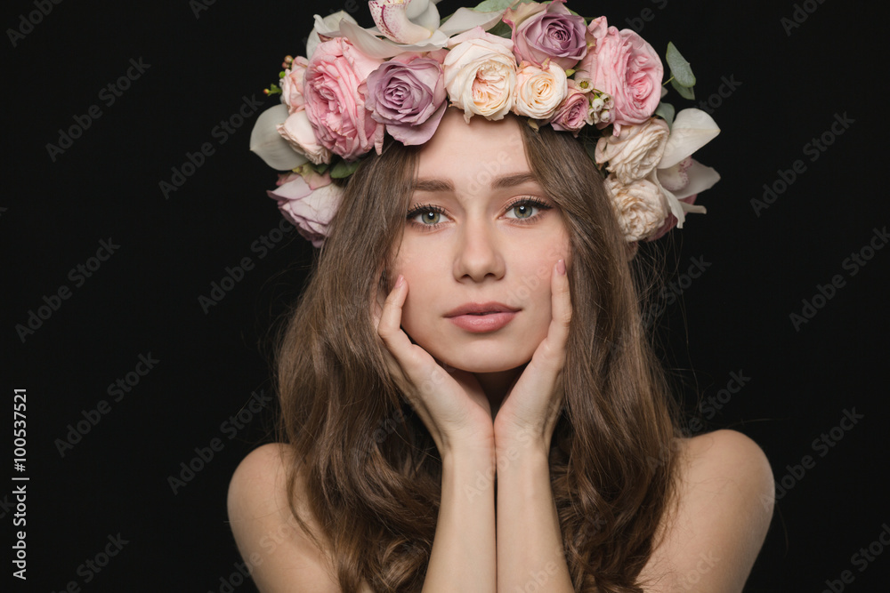 Pretty woman with wreath from flowers on head