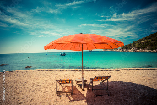 Beach chair with umbrella in seashore